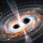 Two giant black holes are set to collide in the next 100 years, and Earth could feel the shockwaves