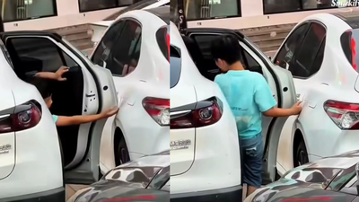 Child opens car door carefully to avoid scratches, a simple moment that reveals powerful parenting |