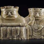 In 1831, a man digging in a Scottish sand dune found a "frozen" crowd of ivory faces that changed history