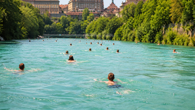 Switzerland’s summer hack: People swim through a river to get home from work