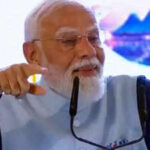 As he achieves record, PM vows faster reforms