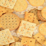Why do biscuit packets have those tiny holes in crackers?