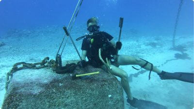 From repairing buoys to making history: Meet the US Coast Guard diver who became the first 'Coastie' to complete the Navy's toughest diving course
