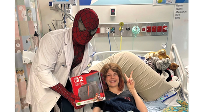 Meet Australia's real-life Spider-Man: Medical student visits sick children and gifts Nintendo Switches while dressed as the superhero