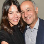 Libbie Mugrabi, ex-wife of billionaire art dealer David Mugrabi, listed her Hamptons mansion for $25 million and later cut the price to $19 million; its court-ordered auction will start at $11 million