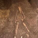 El Salvador archaeologists lifted a burial sealed beneath 2,800-year-old volcanic ash; the person lay face down with a sea turtle-shaped vessel near one hand