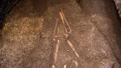 El Salvador archaeologists lifted a burial sealed beneath 2,800-year-old volcanic ash; the person lay face down with a sea turtle-shaped vessel near one hand