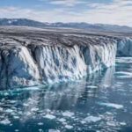 Greenland lost 105 billion tonnes of ice in one year, but scientists say its darkening surface could make future melting worse