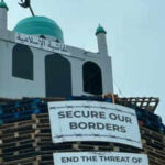 Mosque effigy atop Northern Ireland bonfire sparks outrage; man arrested after anti-Muslim display