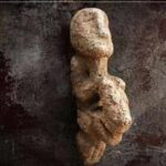 11,000-year-old sculpture of human seated on leopard found on a stone bench at Karahantepe in Türkiye reveals unique Neolithic art