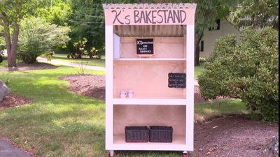 A Cumberland mother's new farm stand was stolen before she could use it; strangers John and Casey Adams rebuilt it for free, even after their tools were stolen