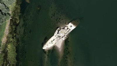 Built in 1913, this 177-foot steam tug survived two world wars but sank after hitting a German mine in 1945; drought has now exposed its wreck in Serbia