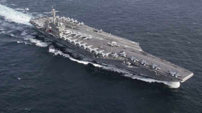 USS Abraham Lincoln sails past Singapore on way home after gruelling Middle East deployment