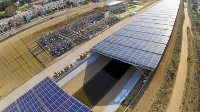 A half-mile solar strip floats above an irrigation canal in Gujarat, generating 1.6 million kilowatt-hours of power while saving 2.38 million gallons of water from evaporation