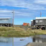 A remote Alaska village is slowly sinking as the frozen ground beneath it thaws, releasing ancient carbon locked away for thousands of years
