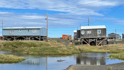A remote Alaska village is slowly sinking as the frozen ground beneath it thaws, releasing ancient carbon locked away for thousands of years