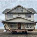 An Iowa family moved the entire $12,000  farmhouse four miles on wheels to create their dream home