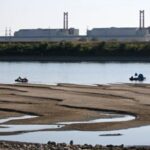 Hungary shut its only nuclear plant for the first time in 44 years after the Danube fell too low to cool its reactors; nearly half its electricity supply is now affected