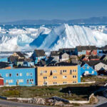 A livestream from Greenland’s UNESCO-listed Ilulissat Icefjord captured a mammoth iceberg rolling over and exposing its blue underside