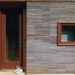 In 2002, Alabama architecture students stacked 72,000 worn carpet tiles into the walls of a family home; Rural Studio has now built more than 200 projects