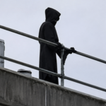 Man dressed as ‘Grim Reaper’ climbs onto hospital roof with long blade and stares at patients, trying to scare them