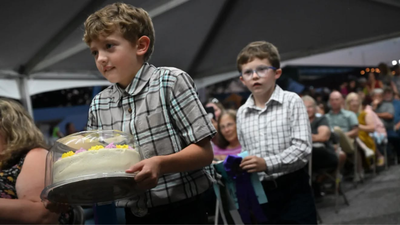 Maryland 10-year-old Herbie Martin IV stayed up until 2 a.m. perfecting his lemon blueberry buttercream cake; the grand champion cake sold for $15,000