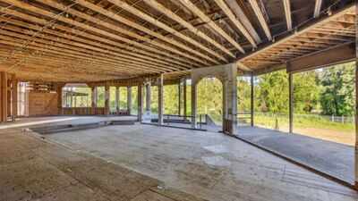 In 1994, Hollywood Video’s founder bought 32 Oregon acres for $1.25 million and began a 52,000-sq-ft mansion; nearly 30 years and 3 owners later, it is still unfinished and asking $4.7 million