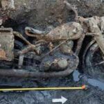 Budapest’s low Danube exposed two German soldiers and a DKW military motorcycle; mud mixed with gas oil preserved identity discs after around 80 years