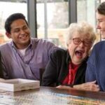 In 2022, a Wisconsin retirement community began housing college students; they now pay about $500 monthly and volunteer eight hours each week with older residents