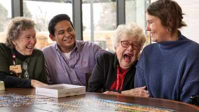 In 2022, a Wisconsin retirement community began housing college students; they now pay about $500 monthly and volunteer eight hours each week with older residents