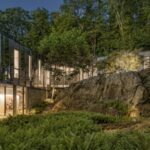 Built to reflect the trees around it, this 19.5-acre New York home almost disappears into the forest; the striking property is now on the market for $15 million