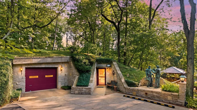 This Ohio home built entirely underground hits the market for $850,000 with a grass-covered roof that the owners literally have to mow
