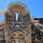 An Iowa priest vowed to build a shrine if he survived pneumonia; after recovering, he spent 42 years using over 100 train carloads of stone to create it