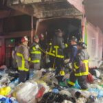 A San Francisco bystander heard screams from a garbage truck after its load had been compacted; 25 firefighters spent more than 2 hours digging a trapped man out alive
