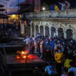 Nepal floods: No bodies to cremate, kin burn kusha effigies as hopes fade for  missing