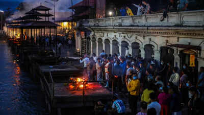 Nepal floods: No bodies to cremate, kin burn kusha effigies as hopes fade for  missing