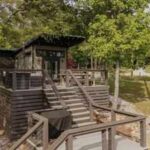 More than 40 Tennessee tiny-home owners are seeking $5 million in a 'zombie HOA' lawsuit, alleging nearly 80% of the HOA budget went to a lawn care company owned by the developer